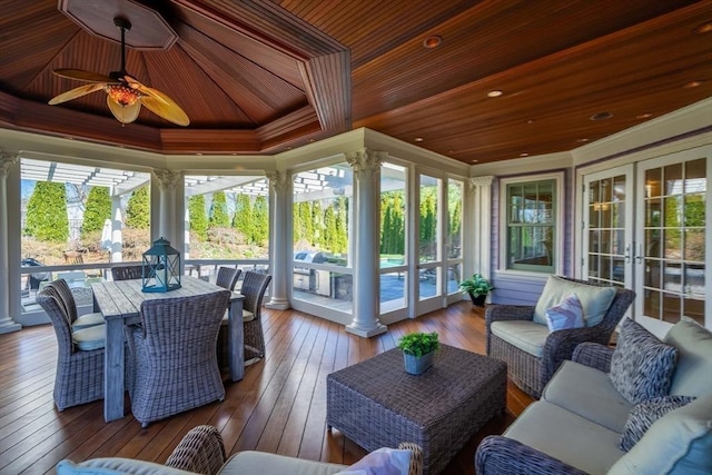 sunroom featuring wooden ceiling and ceiling fan