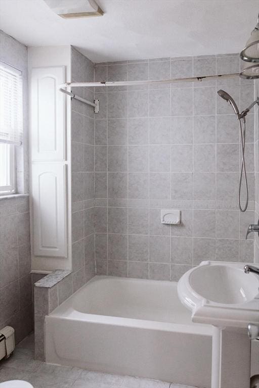 full bathroom with  shower combination and a baseboard radiator