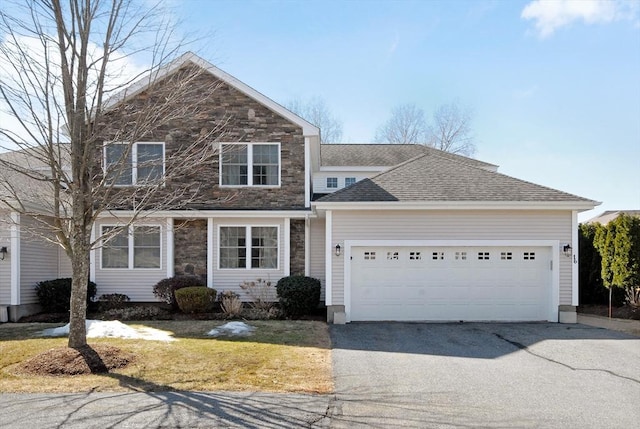 16 John Francis Ln Unit 16, Acton, MA 01720 - traditional home featuring driveway, an attached garage, stone siding, and a shingled roof