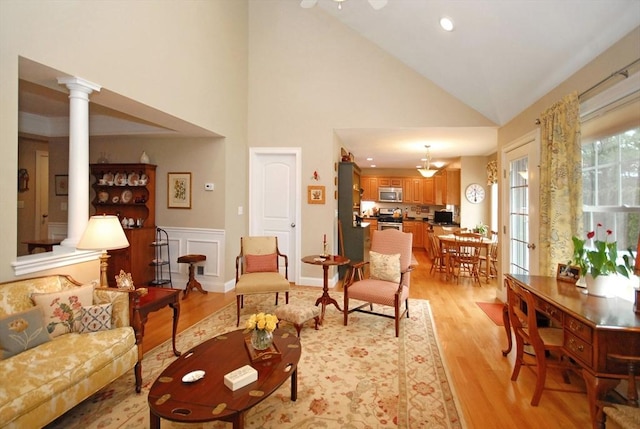16 John Francis Ln Unit 16, Acton, MA 01720 - living room with light wood-type flooring, high vaulted ceiling, recessed lighting, and decorative columns