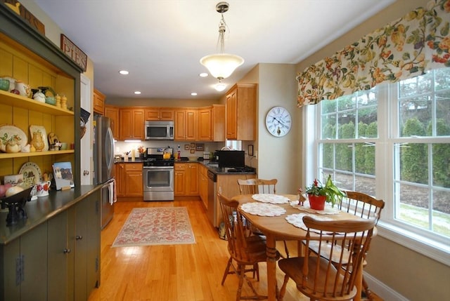 16 John Francis Ln Unit 16, Acton, MA 01720 - kitchen with stainless steel appliances, plenty of natural light, light wood-style flooring, dark countertops, and recessed lighting