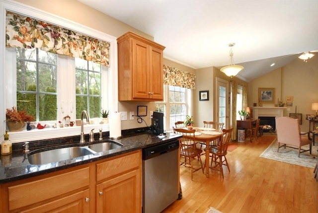 16 John Francis Ln Unit 16, Acton, MA 01720 - kitchen featuring stainless steel dishwasher, a sink, light wood-style flooring, and dark stone countertops