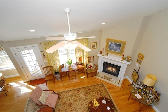 16 John Francis Ln Unit 16, Acton, MA 01720 - living area featuring a ceiling fan, a glass covered fireplace, wood finished floors, baseboards, and recessed lighting