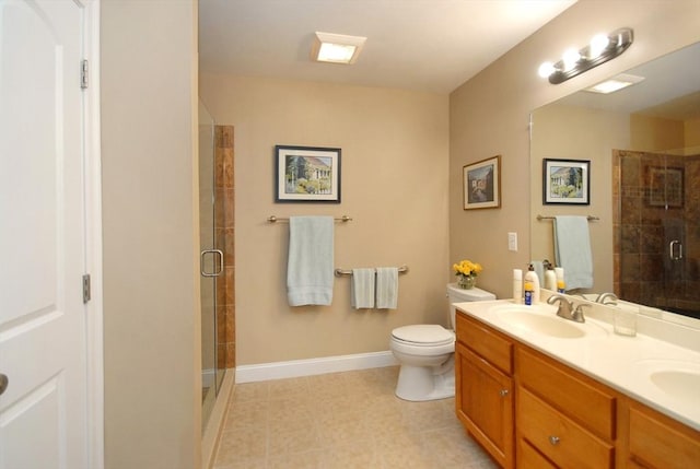 16 John Francis Ln Unit 16, Acton, MA 01720 - bathroom featuring double vanity, a shower stall, tile patterned floors, and toilet