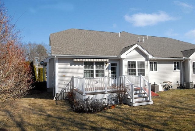 16 John Francis Ln Unit 16, Acton, MA 01720 - rear view of property featuring central air condition unit, a wooden deck, and a yard