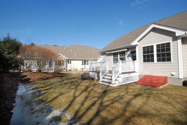 16 John Francis Ln Unit 16, Acton, MA 01720 - rear view of property with a yard, a deck, and roof with shingles