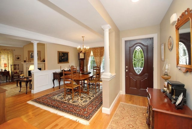 16 John Francis Ln Unit 16, Acton, MA 01720 - foyer featuring light wood-type flooring, ornate columns, and a chandelier