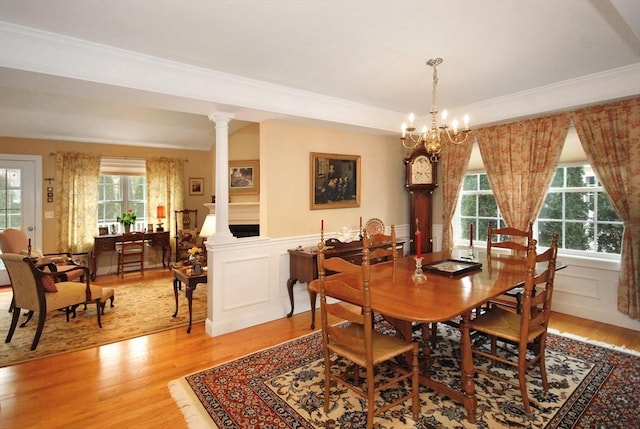 16 John Francis Ln Unit 16, Acton, MA 01720 - dining room with light wood-type flooring, ornamental molding, wainscoting, a chandelier, and a decorative wall