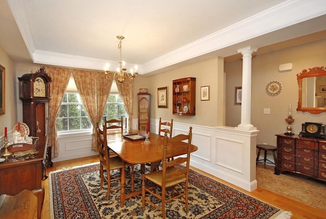 16 John Francis Ln Unit 16, Acton, MA 01720 - dining room with light wood finished floors, ornate columns, ornamental molding, a tray ceiling, and a chandelier