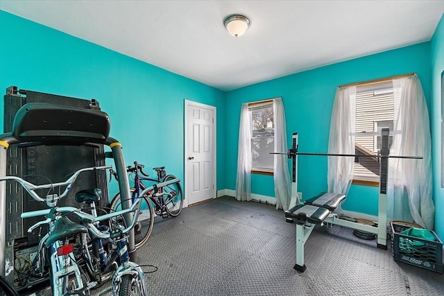 exercise room with baseboards