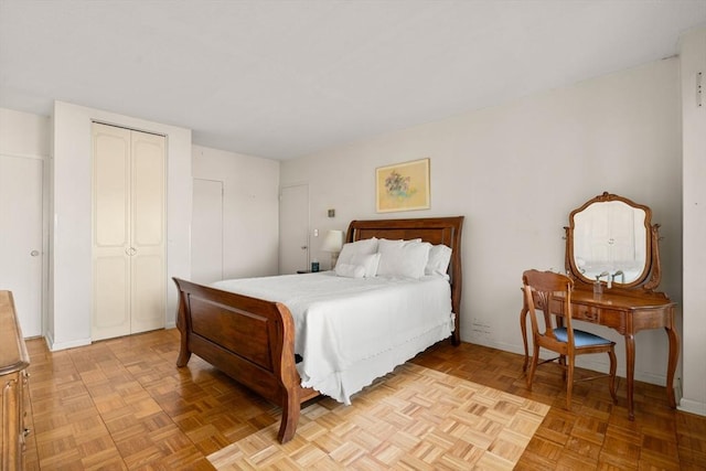 bedroom featuring a closet and baseboards