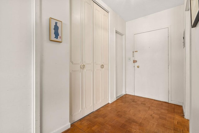 hallway featuring a textured ceiling