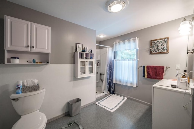 9 Sherman St, Westfield, MA 01085 - bathroom with a stall shower, baseboards, toilet, tile patterned floors, and vanity