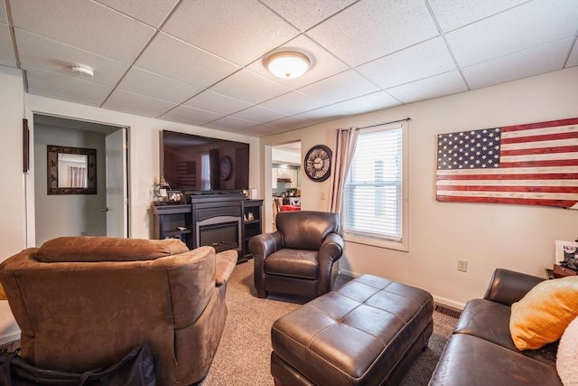 9 Sherman St, Westfield, MA 01085 - carpeted living area featuring a paneled ceiling, a glass covered fireplace, and baseboards