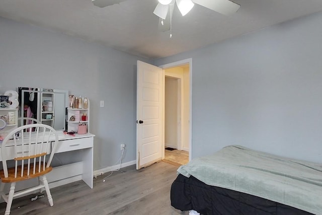 bedroom with ceiling fan and light wood-type flooring