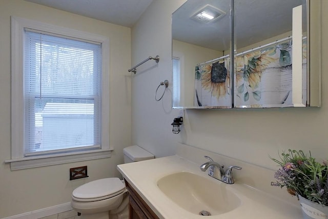 bathroom with vanity, toilet, and a shower with shower curtain