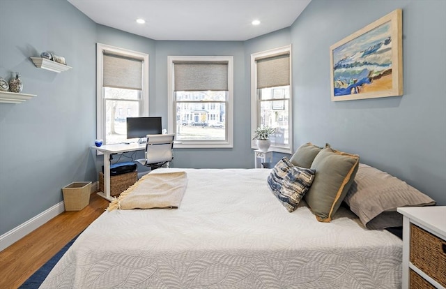 bedroom featuring recessed lighting, wood finished floors, and baseboards