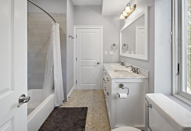 full bath with shower / tub combo, vanity, and toilet