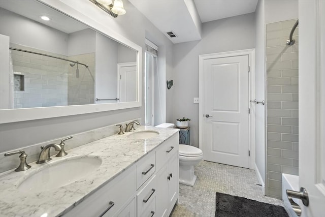 bathroom with walk in shower, a sink, and toilet