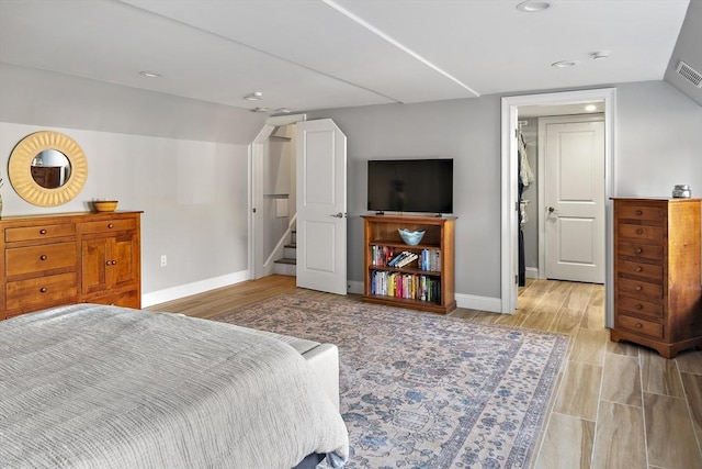 bedroom featuring vaulted ceiling, recessed lighting, visible vents, and baseboards