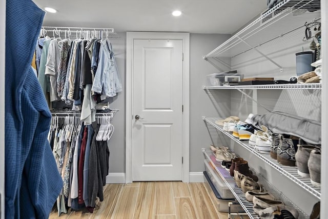 spacious closet with wood finished floors