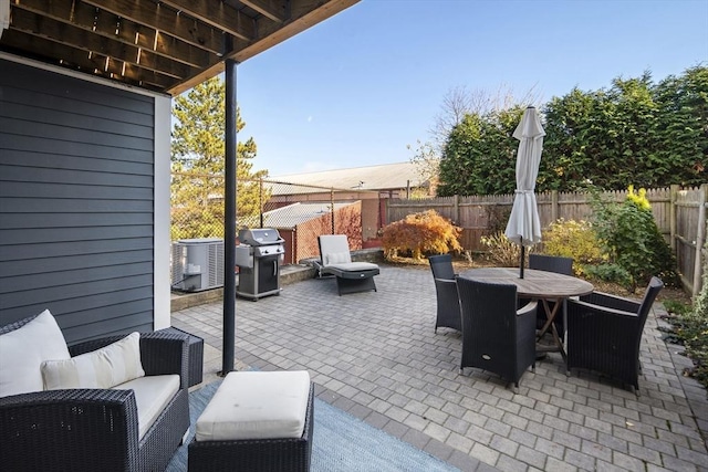 view of patio with outdoor dining area, a fenced backyard, cooling unit, outdoor lounge area, and a grill