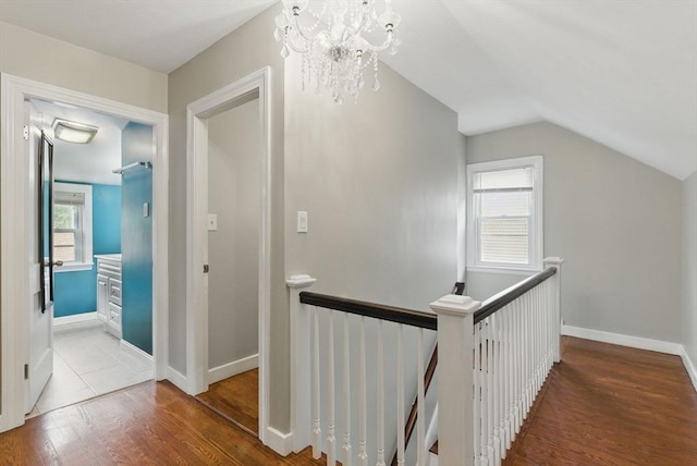 33 Walworth St, Worcester, MA 01602 - hall featuring an upstairs landing, wood finished floors, lofted ceiling, and a chandelier