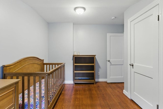 33 Walworth St, Worcester, MA 01602 - bedroom featuring wood finished floors and baseboards