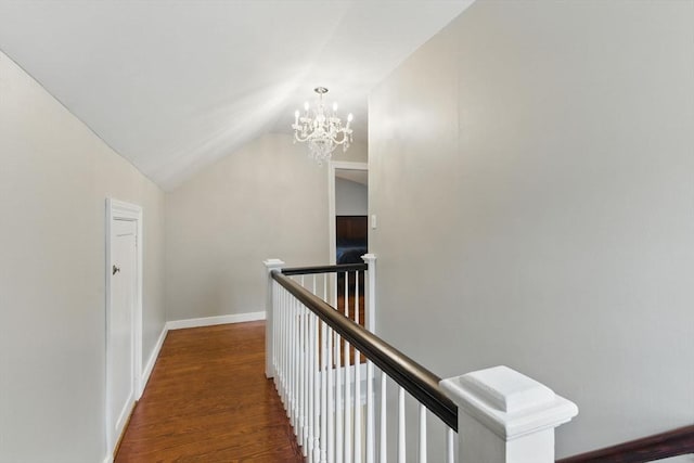 33 Walworth St, Worcester, MA 01602 - hall with an upstairs landing, lofted ceiling, a chandelier, and wood finished floors