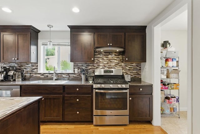 33 Walworth St, Worcester, MA 01602 - kitchen with appliances with stainless steel finishes, dark brown cabinetry, tasteful backsplash, and recessed lighting