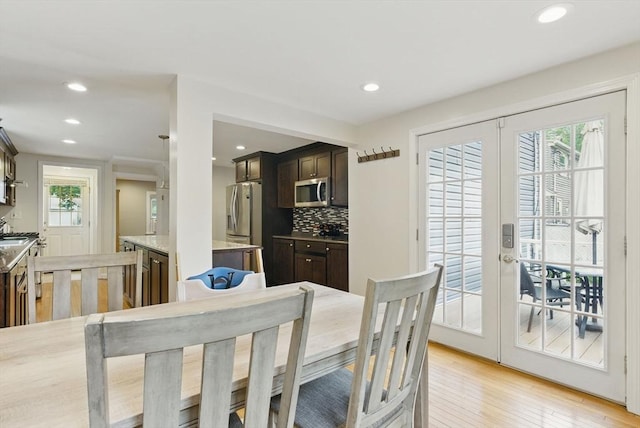 33 Walworth St, Worcester, MA 01602 - dining room featuring light wood finished floors, recessed lighting, and french doors