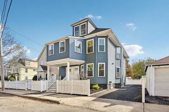 view of front of home featuring a porch and a garage