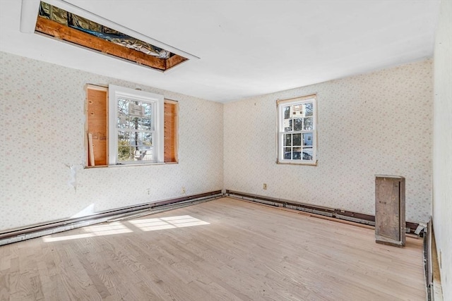 spare room with light hardwood / wood-style flooring