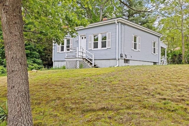 15 Rand St, Randolph, MA 02368 - view of front of property featuring a chimney and a front yard