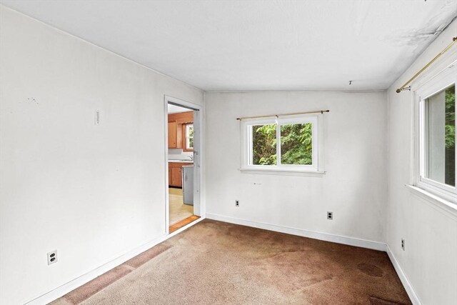 15 Rand St, Randolph, MA 02368 - spare room with light carpet and baseboards