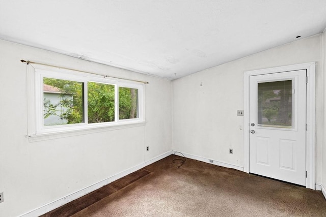 15 Rand St, Randolph, MA 02368 - spare room featuring dark carpet and baseboards