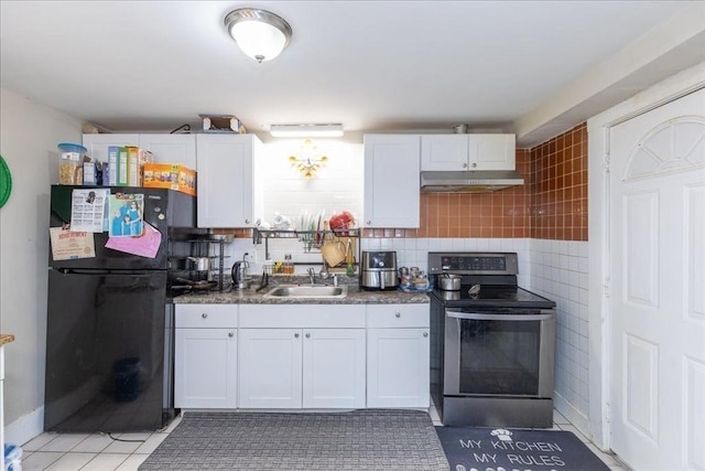 kitchen with electric stove, white cabinetry, and sink