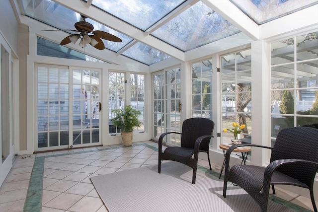 sunroom with ceiling fan and lofted ceiling