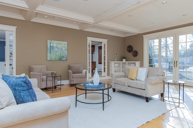 living room with light hardwood / wood-style flooring, french doors, and ornamental molding