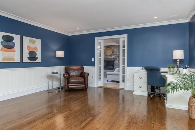 home office featuring hardwood / wood-style floors and crown molding