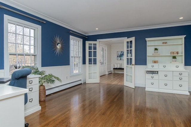 unfurnished office featuring french doors, dark hardwood / wood-style flooring, baseboard heating, and ornamental molding