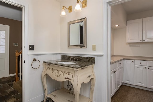 bathroom with sink and a chandelier