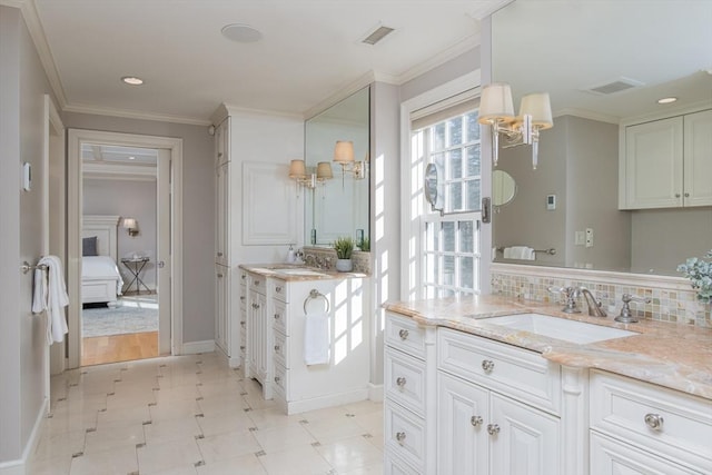 bathroom featuring tasteful backsplash, crown molding, and vanity