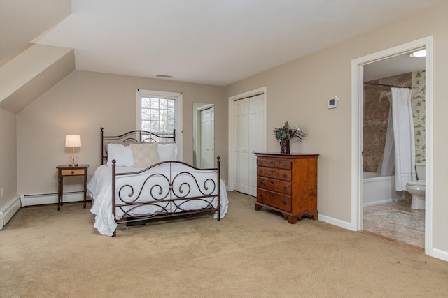 carpeted bedroom featuring ensuite bathroom and a closet