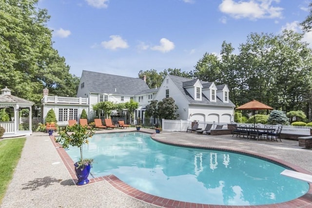 view of pool featuring a gazebo and a patio