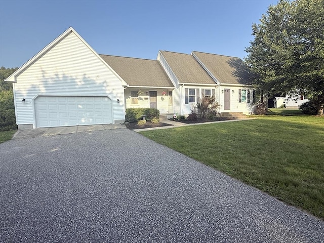 6 Gates St, Monson, MA 01057 - view of front of home featuring driveway, a garage, and a front yard