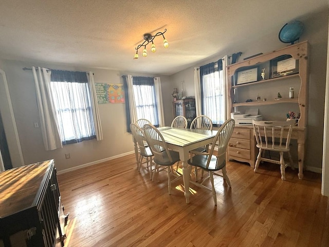 6 Gates St, Monson, MA 01057 - dining space with light wood finished floors and a textured ceiling