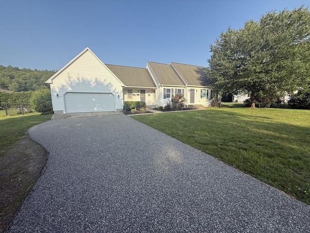 6 Gates St, Monson, MA 01057 - ranch-style home featuring asphalt driveway, a front yard, and a garage