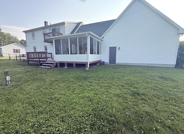 6 Gates St, Monson, MA 01057 - back of property with a sunroom, a lawn, a chimney, and a balcony