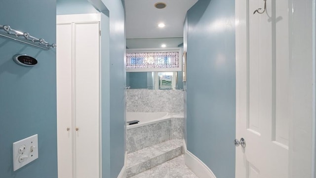 full bathroom featuring a bath and recessed lighting